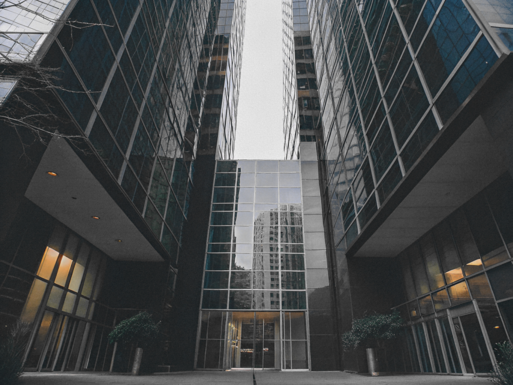Vancouver office building with sleek glass exterior, captured from a low angle.